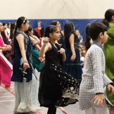 Elementary students performing a Bhangra dance for their school